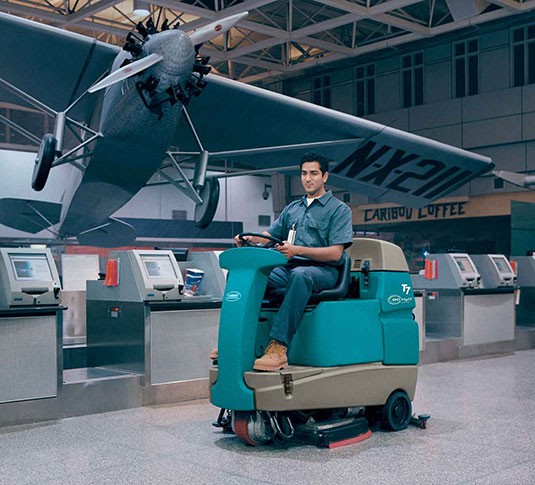 T7+ Ride-On Floor Scrubber in hanger